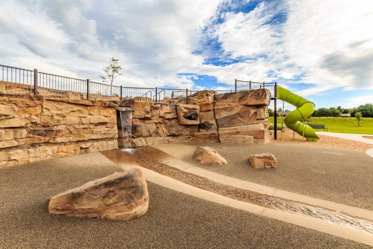 Rockwork with simulated waterfall at park.