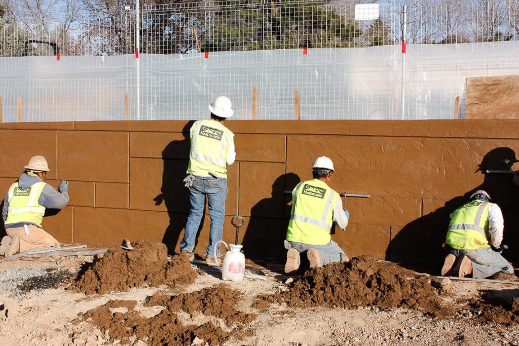 This picture shows the team hard at work getting the shotcrete wall in place.