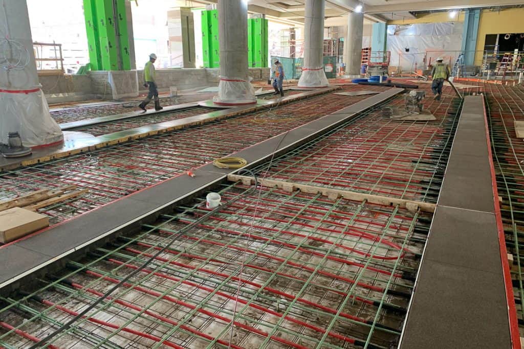 Ongoing construction showing the forming and pouring of concrete.