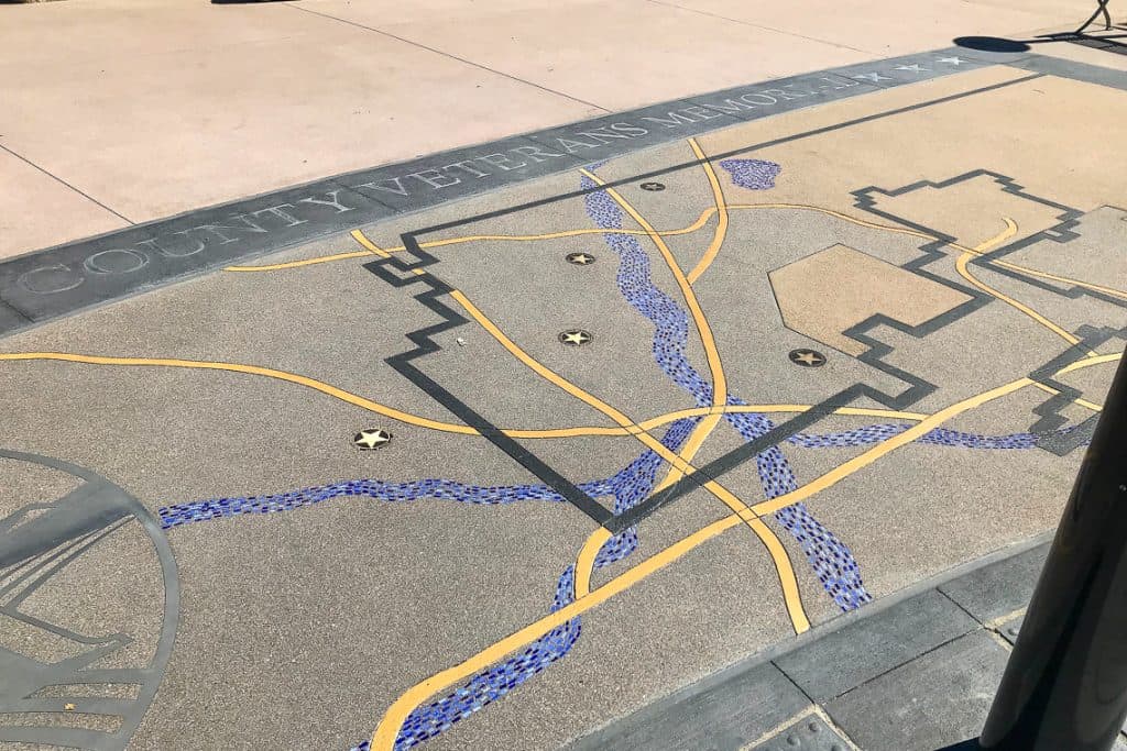 Flatwork design featuring the county’s veterans memorial title and litho mosaic designs.